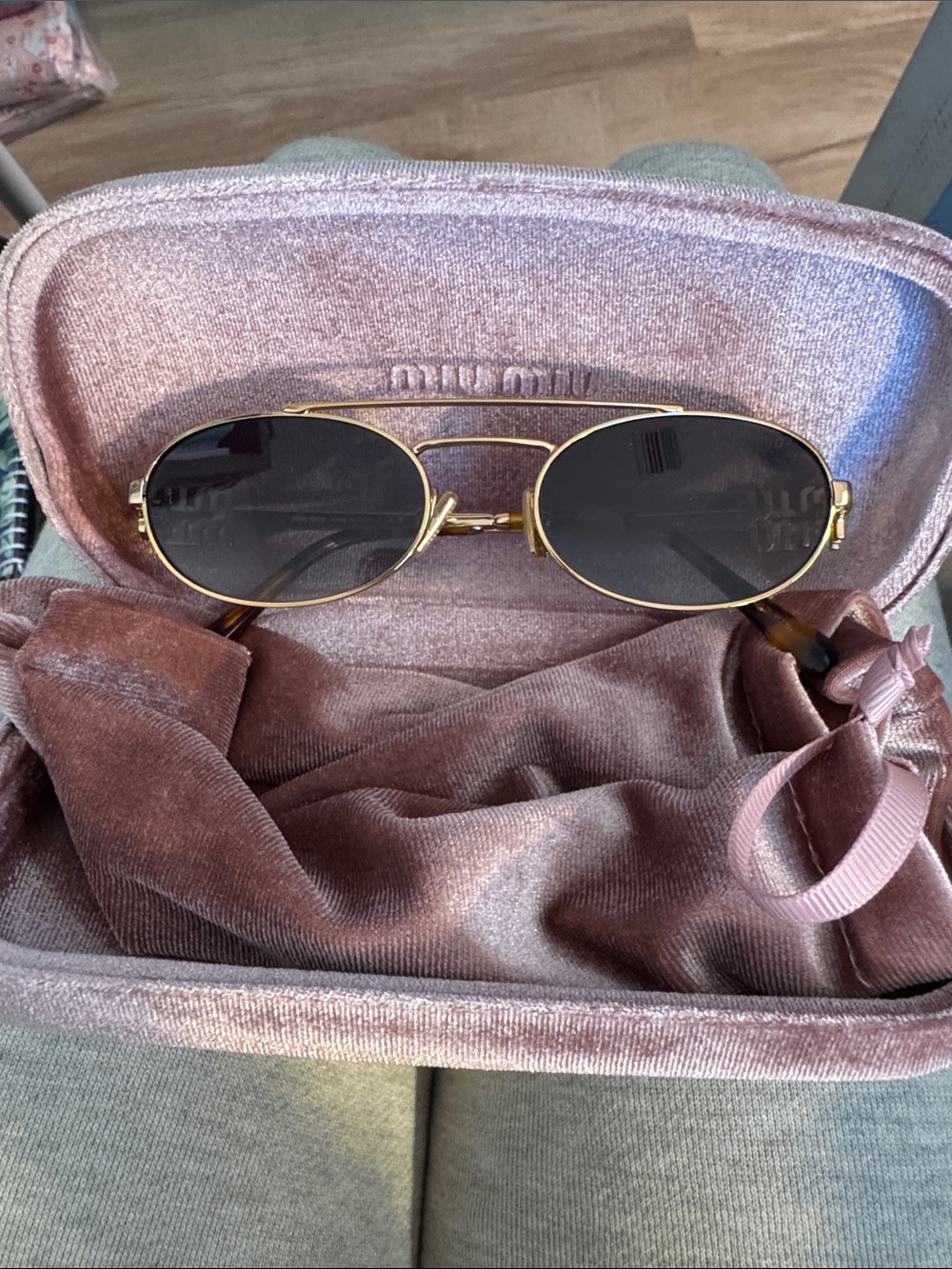 Miu Miu Gold Frame Sunglasses with Black Lenses